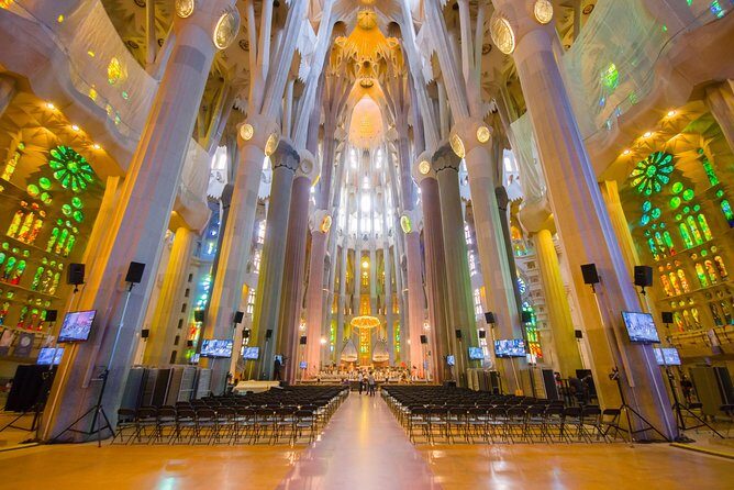 Sagrada Familia Guided Tour with Towers Access - First Stop: Emporio Souvenirs Check-In and Smooth Entry