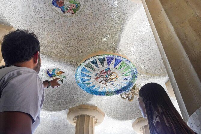 Sagrada Familia & Park Guell Guided Tour with Skip The Line - Entering La Sagrada Familia: symbolism, headsets, and the inside experience